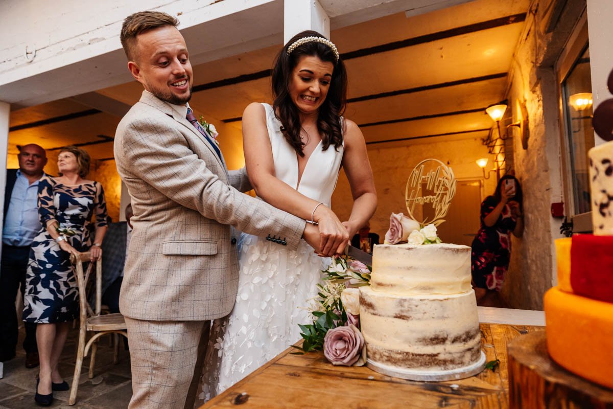 cutting the cake wedding day Wyresdale park photography