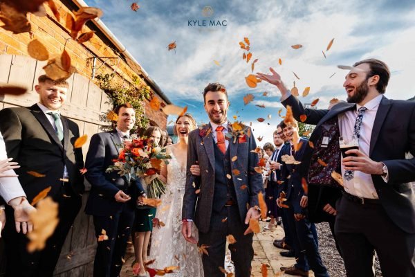 leaves wedding colour confetti bride groom smiles