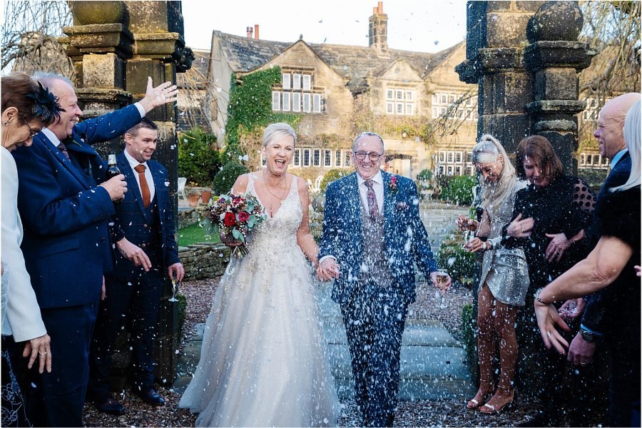 wedding confetti's bride groom guests laughter winter nYE Holdsworth House, Halifax
