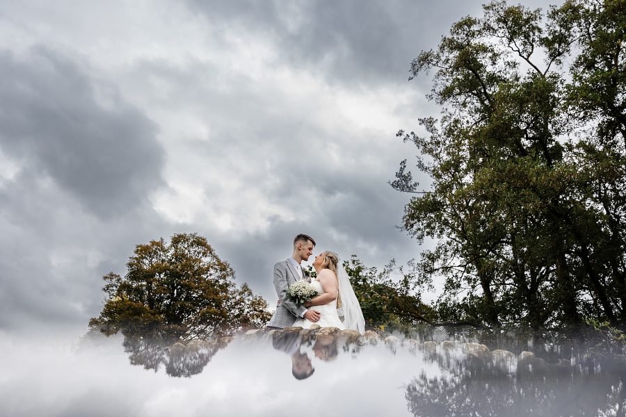 The Out Barn Wedding venue bride groom portraits countryside