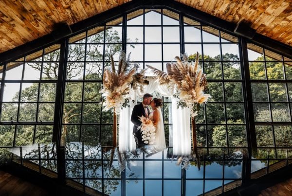 hidden river barn wedding venue bride groom window