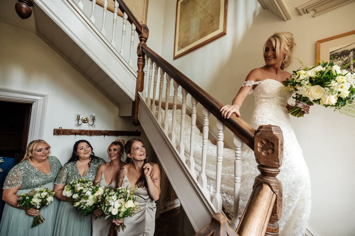 bride meeting the bridesmaid dress flowers ceremony 