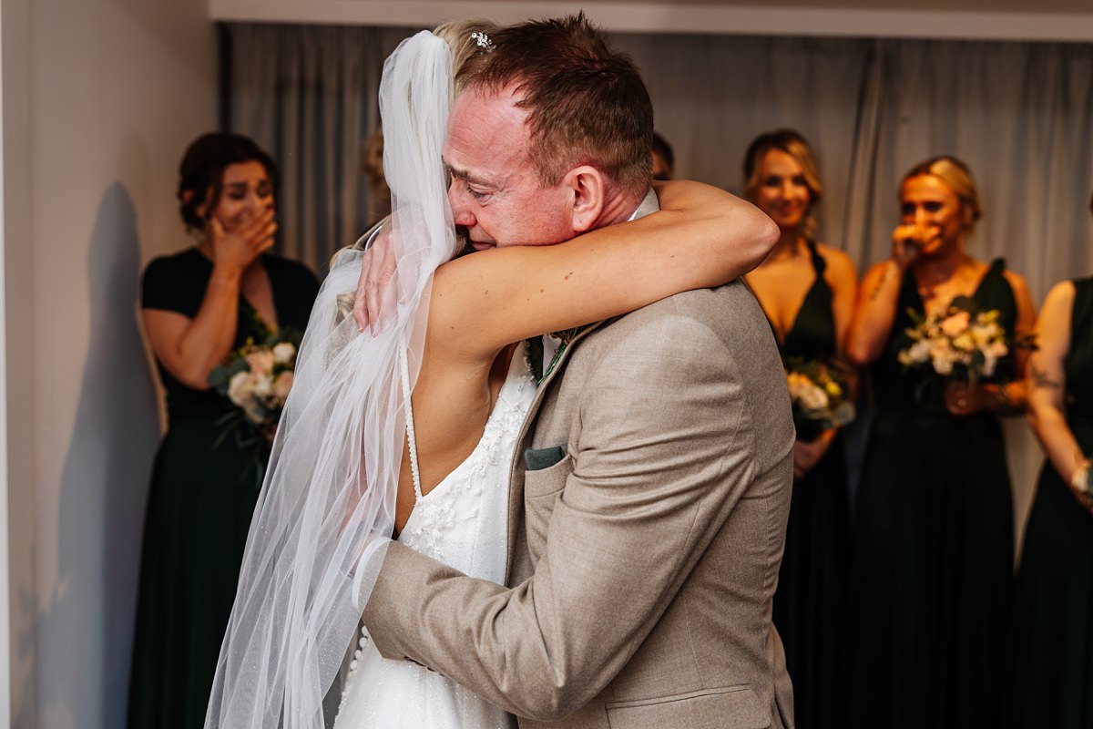 bride hugging father of the bride bashall barn wedding photography