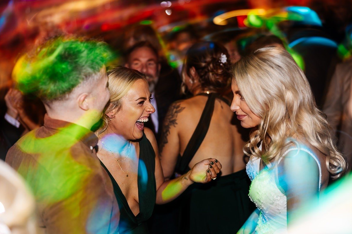 first dance wedding photography bashall barn family friends laughing dancing 