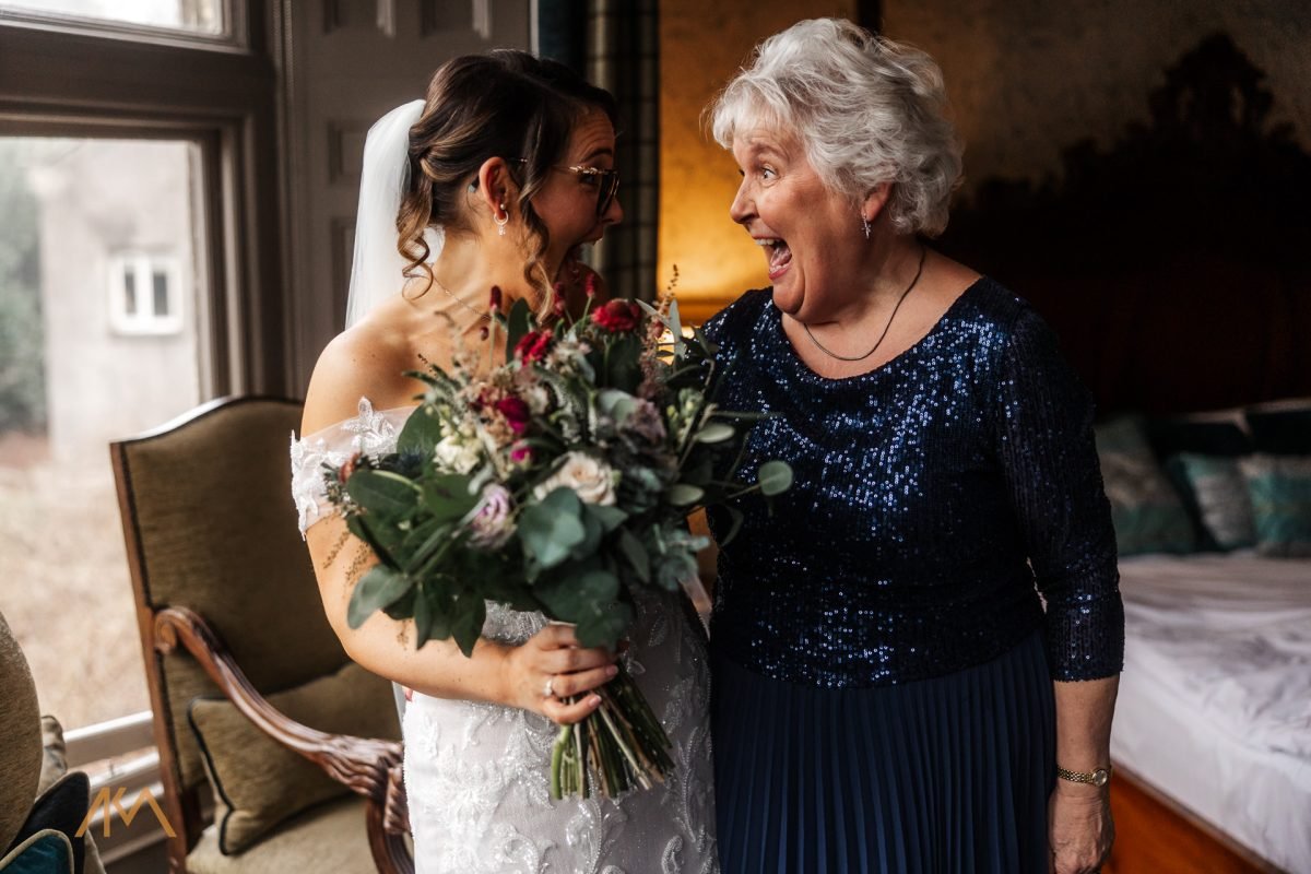 bride smiles laughter brides mum Mitton Hall Winter Wedding