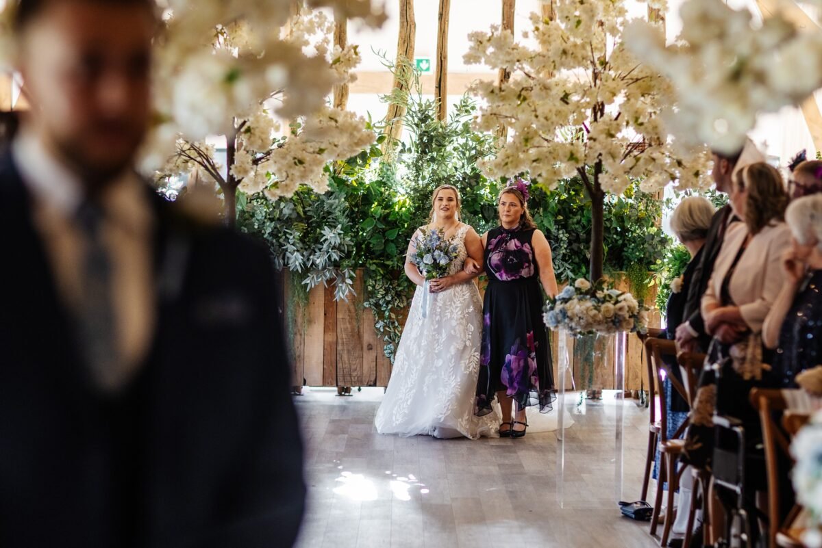 bride ceremony wedding flowers river barn