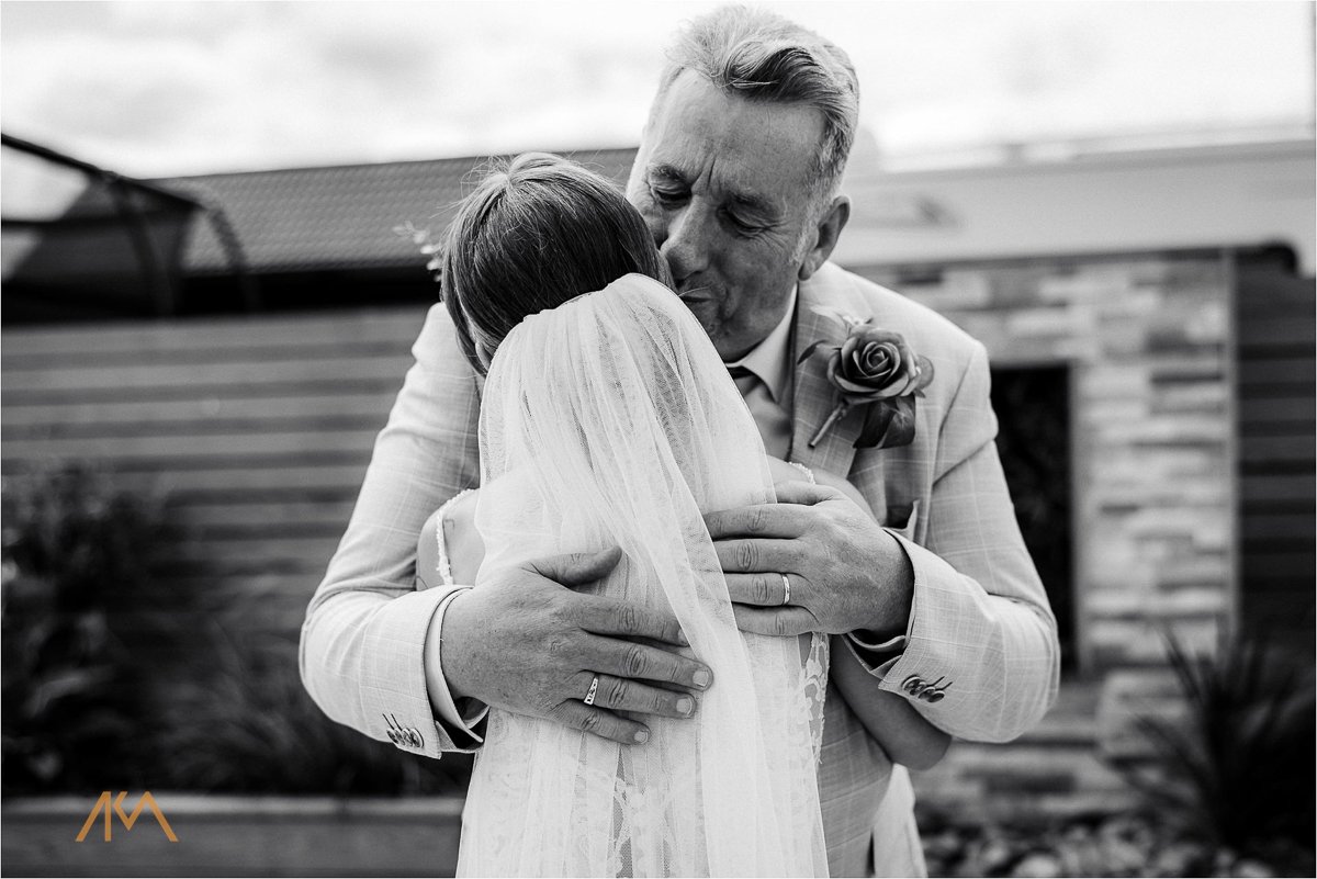 first look farther bride kisss hugs lancashire Tipis at Riley Green