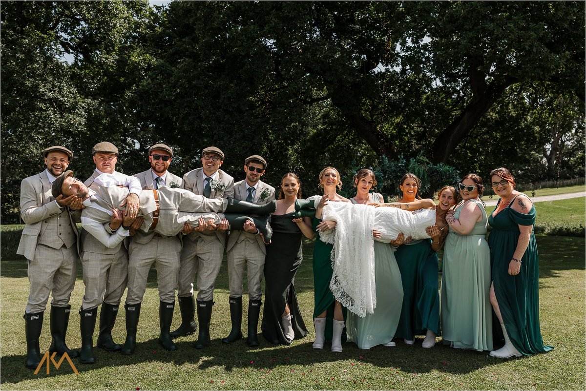 bride groom lifting group photos Tipis at Riley Green