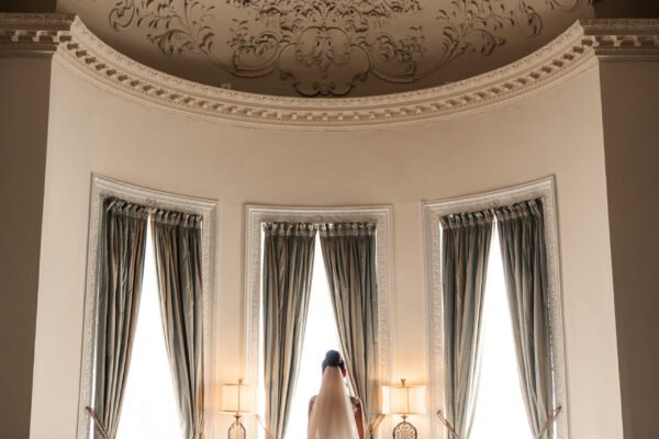 bride in window wedding dress