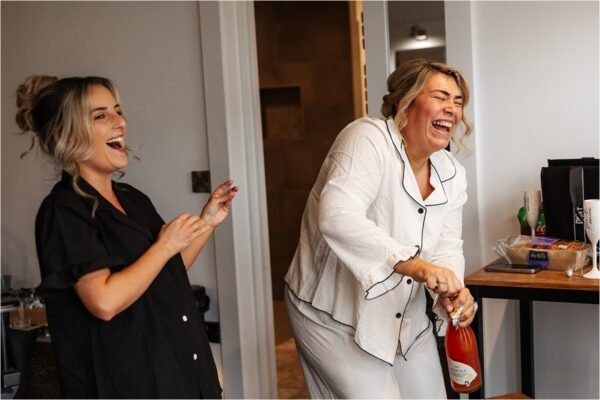 bride opening bottle bashall barn