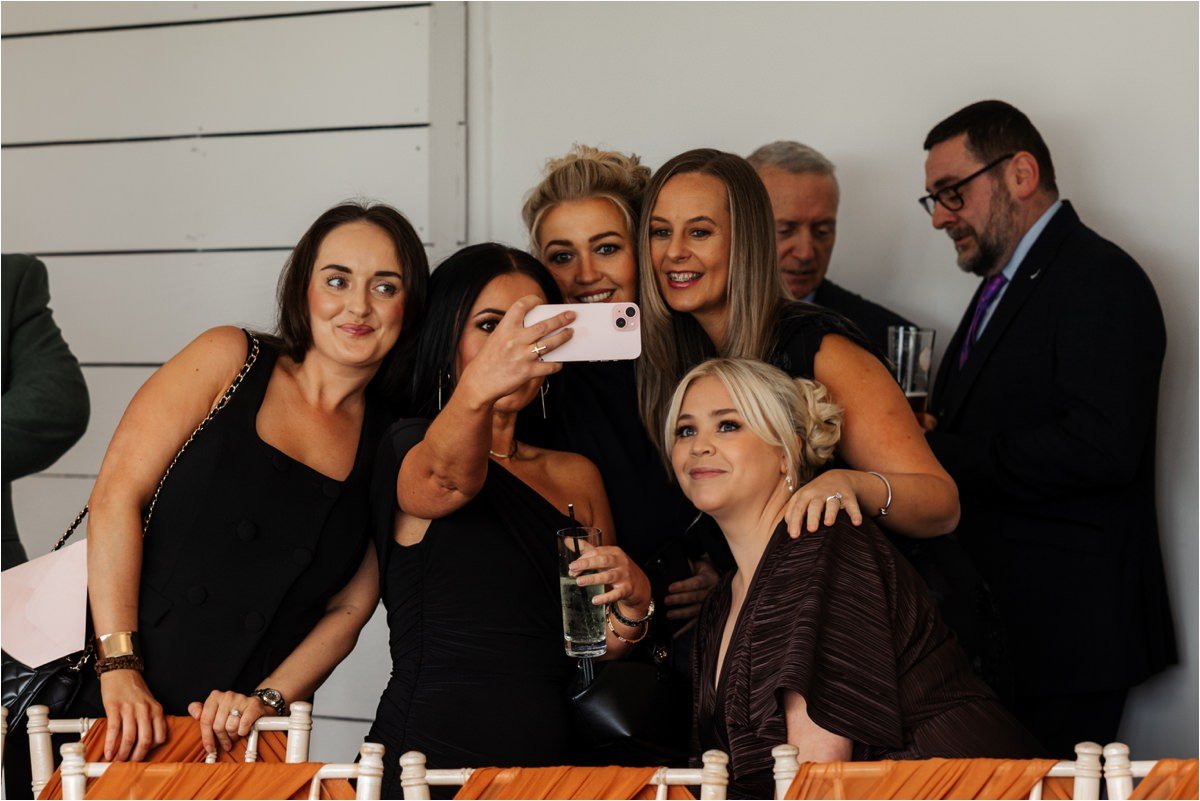 wedding guests selfy in the ceremony room