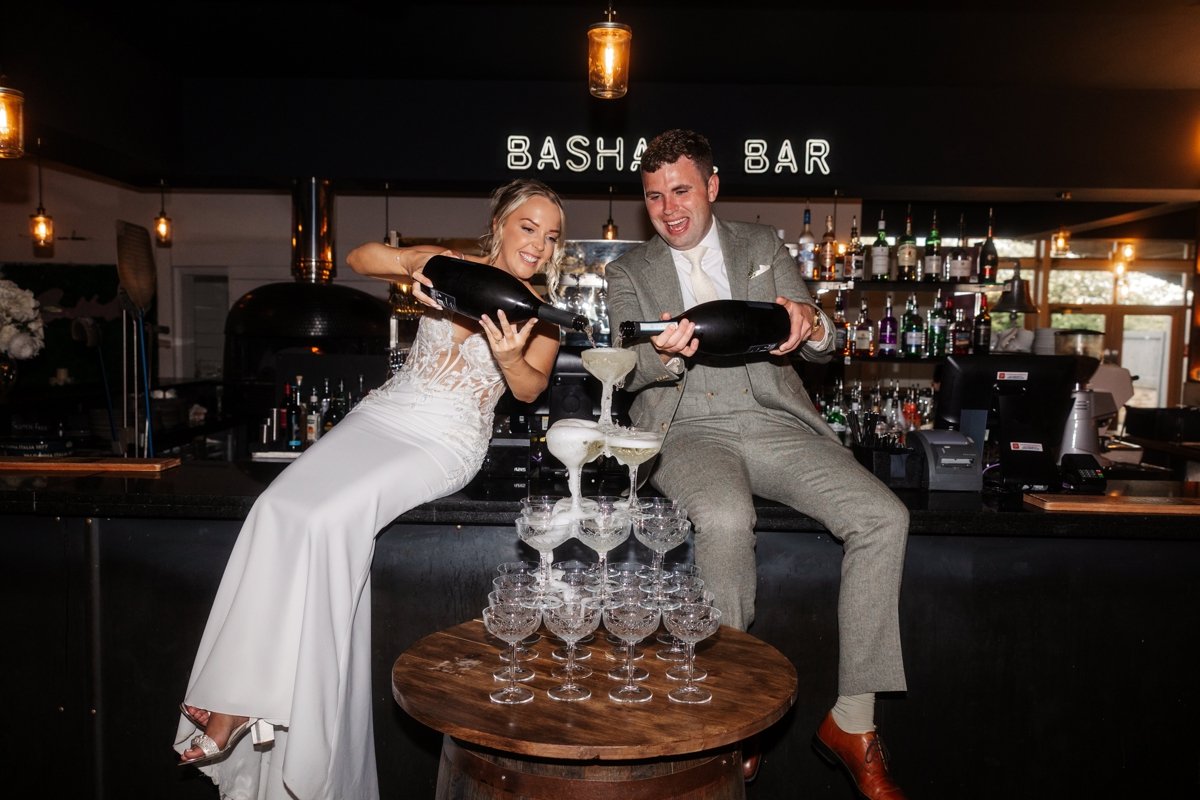 Champagne pore birde groom bashall barn wedding venue