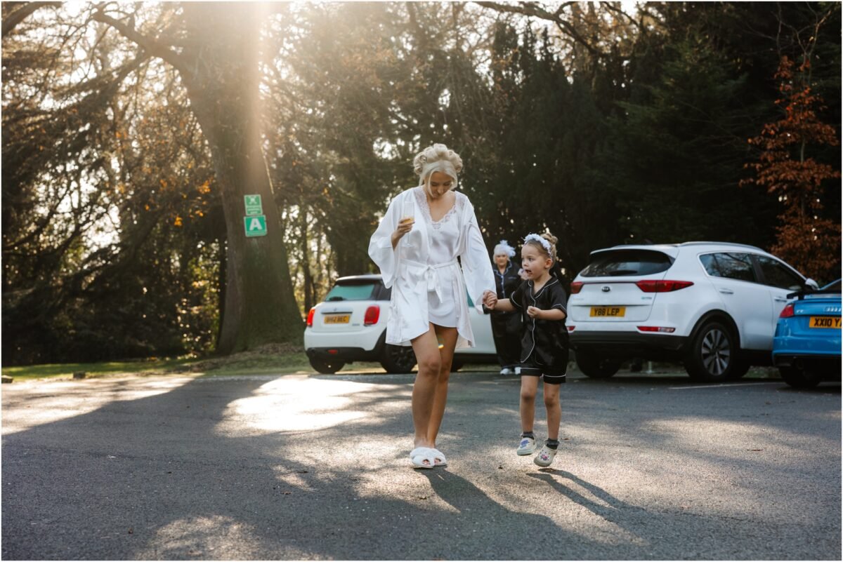 bride walking with flower girl wedding bartle hall