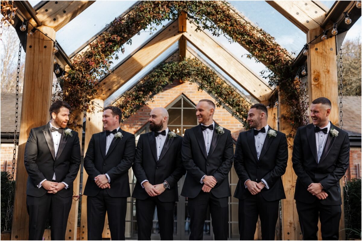 groomsmen blacksuit flowers bartle hall