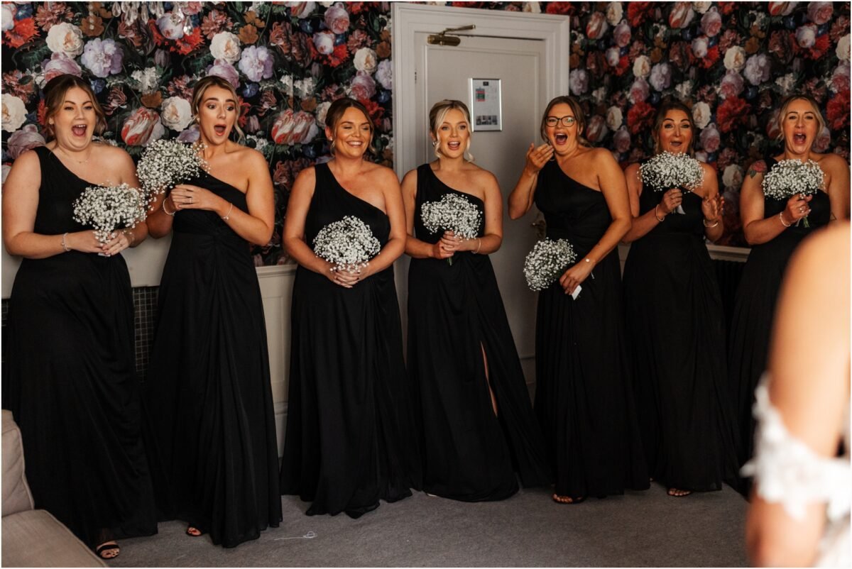 bridesmaids first look bride bartle hall wedding venue