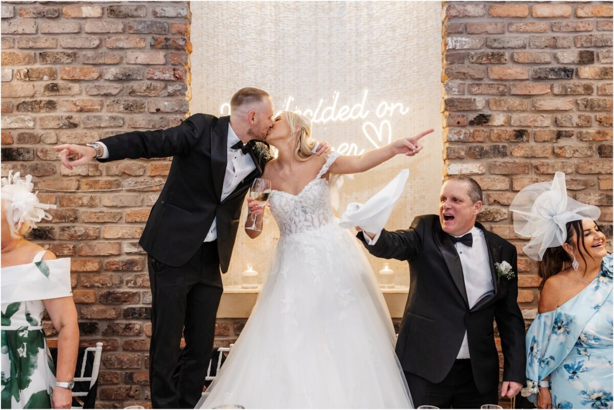 bride groom kissing bartle hall venue