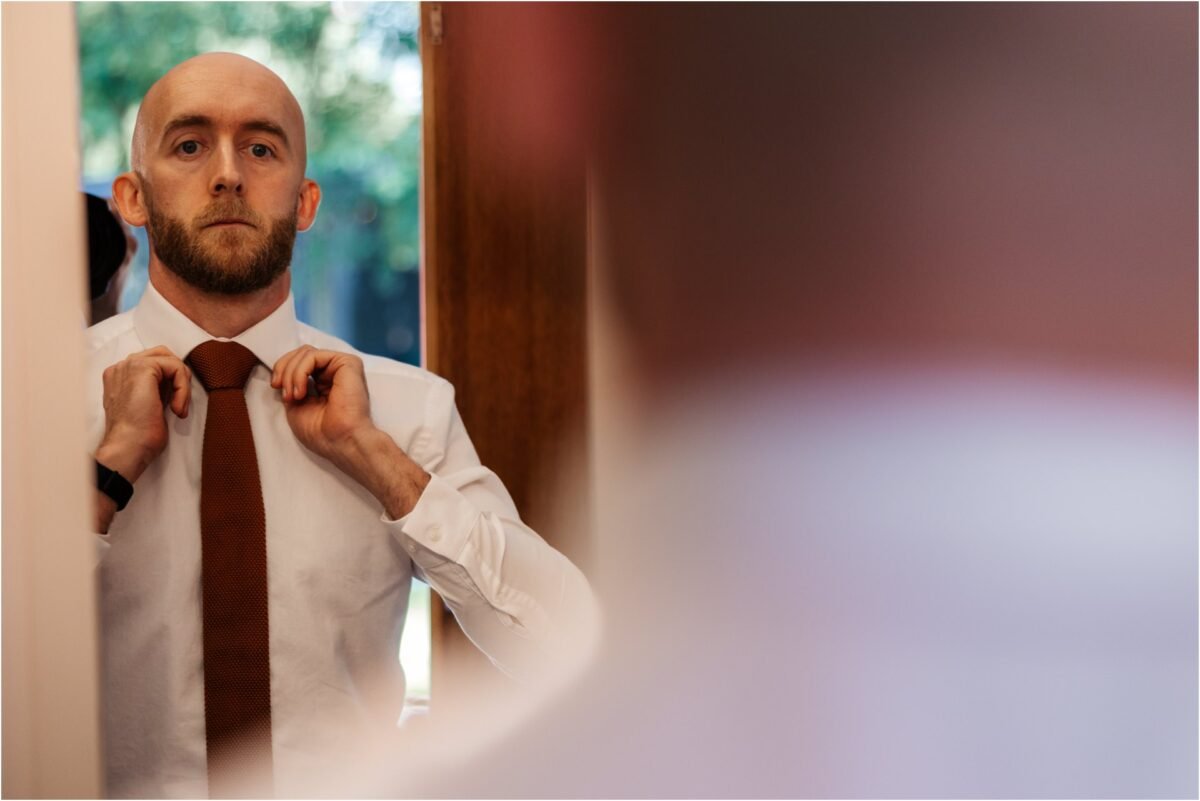 groom wedding suit lancashire photography red tie