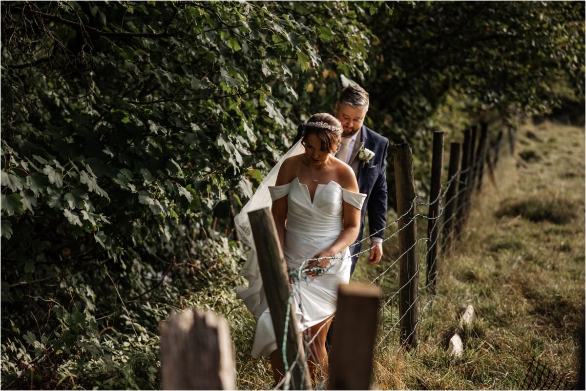 walking to take portraits bride groom