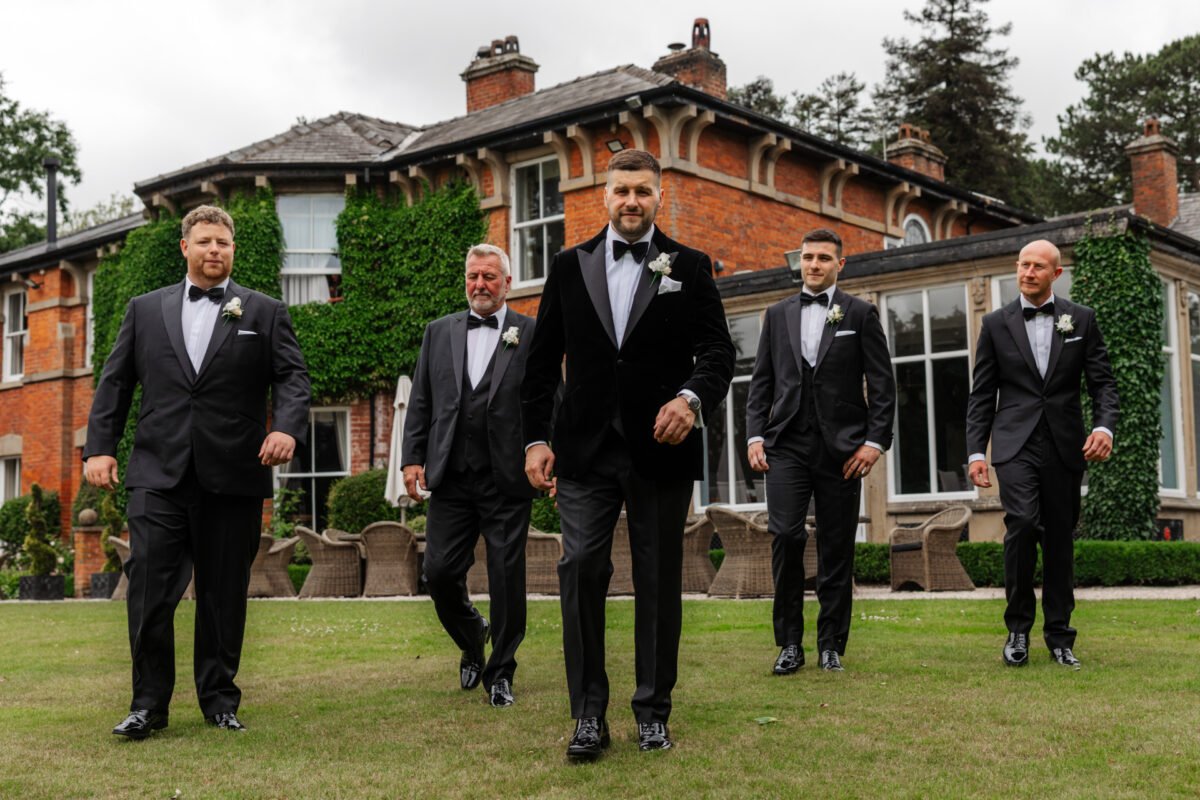 groomsmen bartle hall walking suits flowers