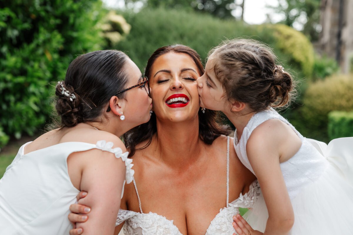 children kiss bride on cheek shireburn arms