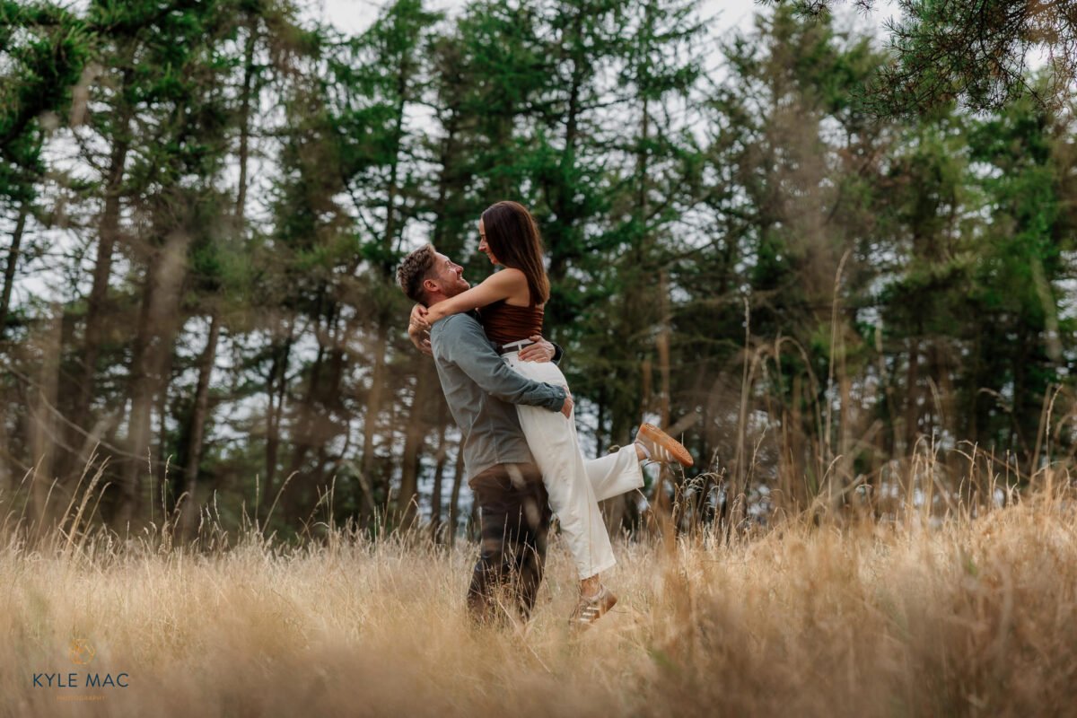 wedding portraits bride groom lifting feild ribble valley lancashire