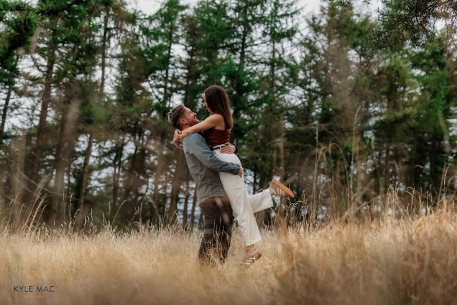 wedding portraits bride groom lifting feild ribble valley lancashire