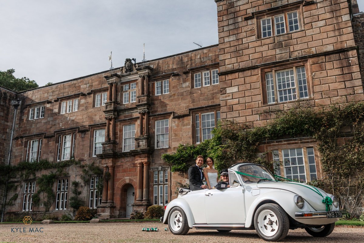 Bride and groom walking together at Browsholme Hall, Ribble Valley wedding venue