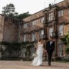 browsholme hall ribble valley wedding venue bride groom walking portraits