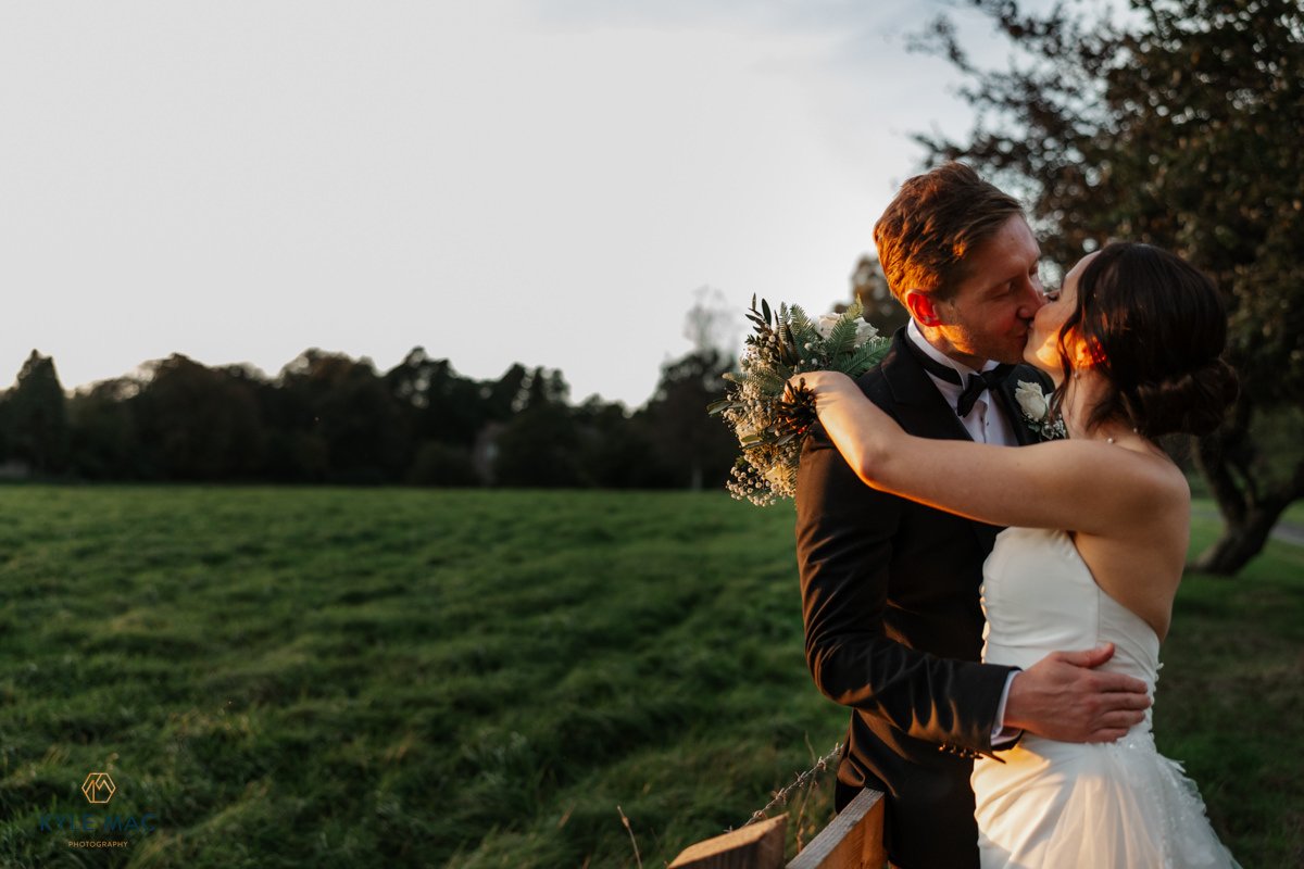 Bride and groom laughing together on the lawn, Browsholme Hall wedding photography